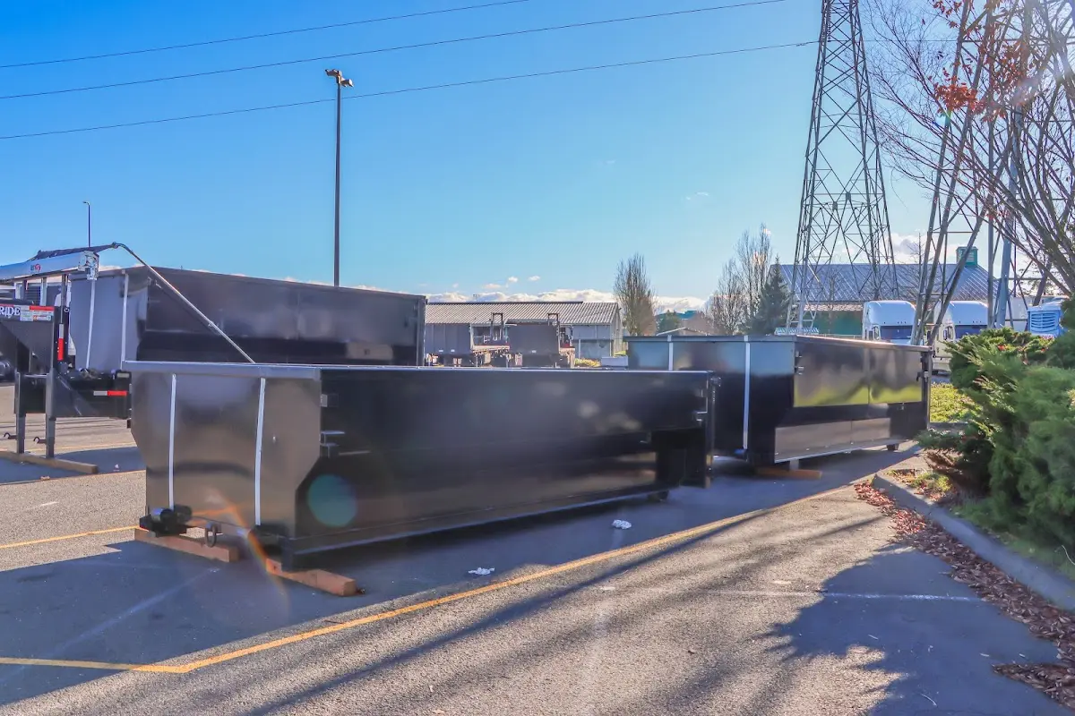 Roll-off dumpster ready for waste disposal at job site for 12 Yard Dumpster Rental in Madison